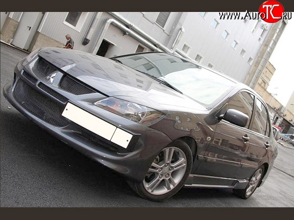 15 999 р. Передний бампер Evo Mitsubishi Lancer 9 2-ой рестайлинг седан (2005-2009) (Без сетки, Неокрашенный)  с доставкой в г. Екатеринбург