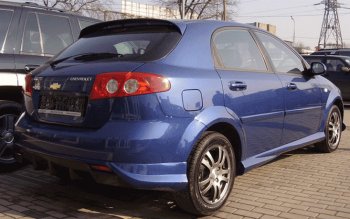 4 099 р. Накладка заднего бампера ATL Chevrolet Lacetti хэтчбек (2002-2013) (Неокрашенная)  с доставкой в г. Екатеринбург. Увеличить фотографию 1